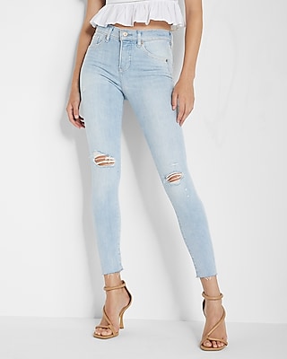 Mid Rise Light Wash Ripped Raw Hem Skinny Jeans