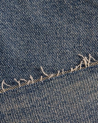 Mid Rise Medium Wash Raw Hem 7" Inseam Loose Jean Shorts