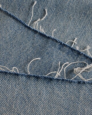 High Waisted Light Wash Raw Hem Ripped Sides Wide Leg Jeans
