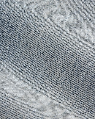 Mid Rise Light Wash Front Vent '70s Flare Jeans