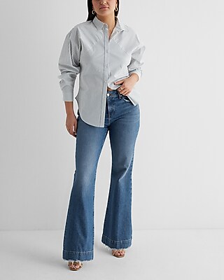 Mid Rise Medium Wash Raw Hem '70s Flare Jeans