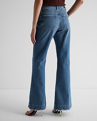 Mid Rise Medium Wash Raw Hem '70s Flare Jeans