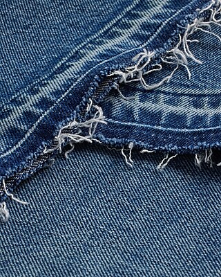 Mid Rise Medium Wash Raw Drop Hem '70s Flare Jeans
