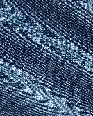 Mid Rise Medium Wash Raw Drop Hem '70s Flare Jeans