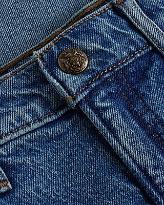 Mid Rise Medium Wash Raw Drop Hem '70s Flare Jeans