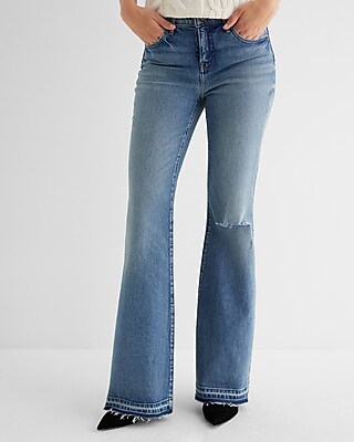 Mid Rise Medium Wash Raw Drop Hem '70s Flare Jeans
