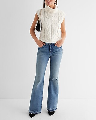 Mid Rise Medium Wash Raw Drop Hem '70s Flare Jeans