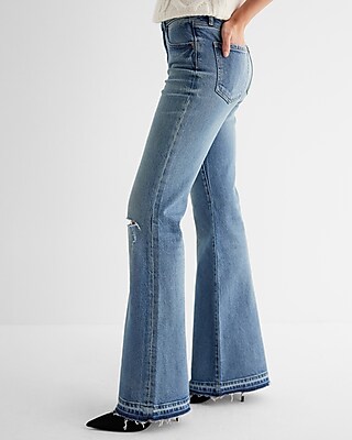 Mid Rise Medium Wash Raw Drop Hem '70s Flare Jeans