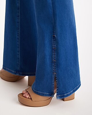 Mid Rise Medium Wash Slit Hem '70s Flare Jeans