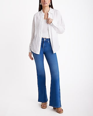 Mid Rise Medium Wash Slit Hem '70s Flare Jeans