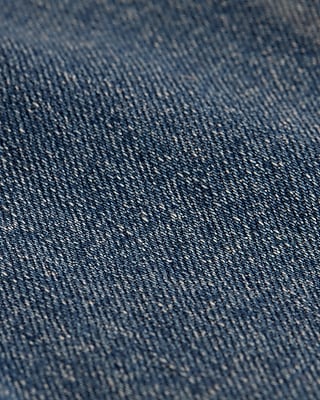 High Waisted Medium Wash Front Seam Raw Hem Relaxed Flare Jeans