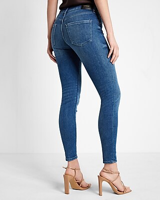 Mid Rise Medium Wash Button Fly Skinny Jeans