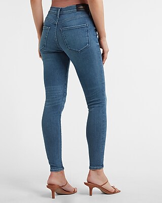 Mid Rise Medium Wash Button Fly Skinny Jeans