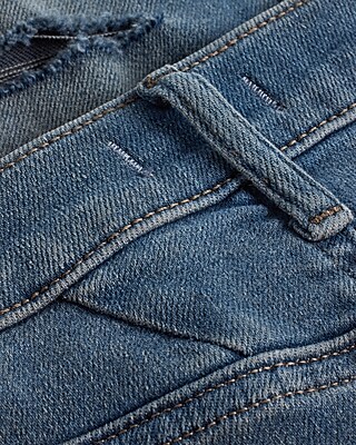 Mid Rise Medium Wash Ripped Skinny Jeans