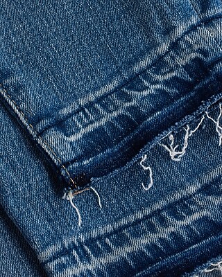 High Waisted Medium Wash Ripped Raw Drop Hem Skinny Jeans