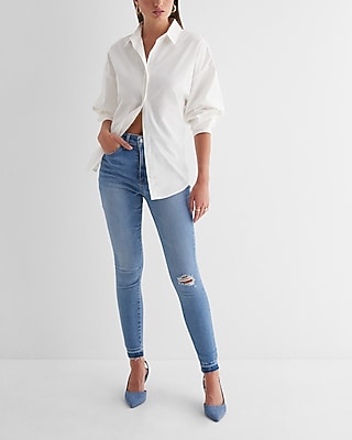High Waisted Medium Wash Ripped Raw Drop Hem Skinny Jeans