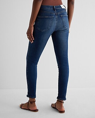 Mid Rise Dark Wash Raw Hem Skinny Jeans