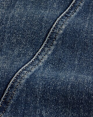 Mid Rise Medium Wash Twist Seam Skyscraper Jeans