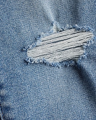 Mid Rise Medium Wash Ripped Raw Hem Skinny Jeans