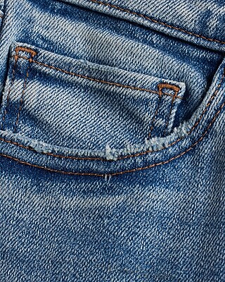 Mid Rise Medium Wash Ripped Raw Hem Skinny Jeans