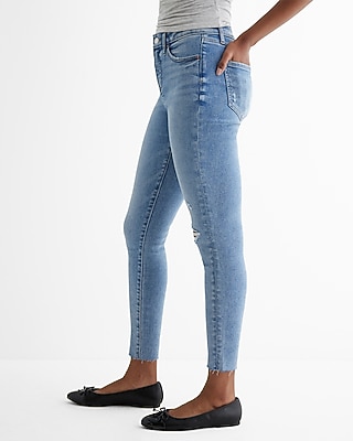 Mid Rise Medium Wash Ripped Raw Hem Skinny Jeans
