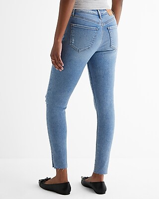 Mid Rise Medium Wash Ripped Raw Hem Skinny Jeans