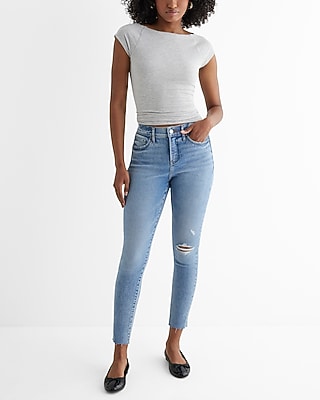 Mid Rise Medium Wash Ripped Raw Hem Skinny Jeans