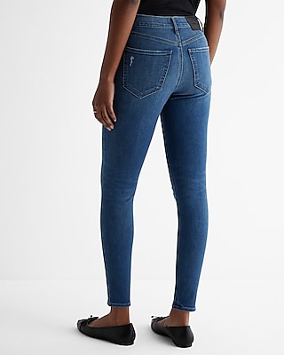 Mid Rise Medium Wash Ripped Skinny Jeans