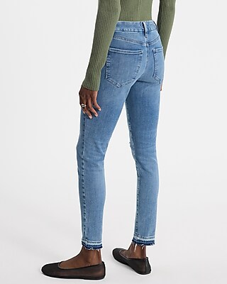 Mid Rise Light Wash FlexX Ripped Raw Hem Skinny Jeans