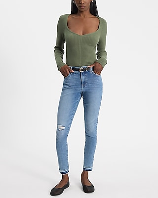 Mid Rise Light Wash FlexX Ripped Raw Hem Skinny Jeans