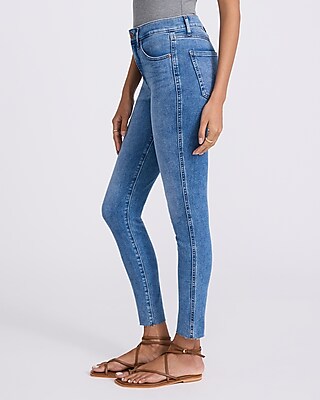 Mid Rise Medium Wash Raw Hem Skinny Jeans