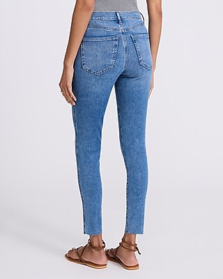 Mid Rise Medium Wash Raw Hem Skinny Jeans