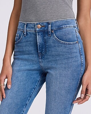 Mid Rise Medium Wash Raw Hem Skinny Jeans