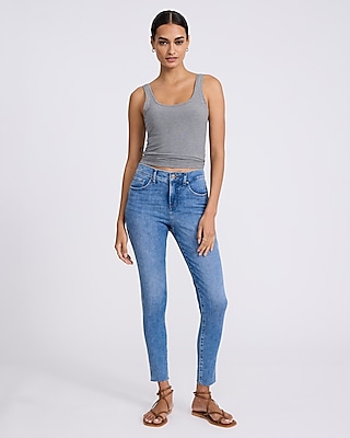 Mid Rise Medium Wash Raw Hem Skinny Jeans