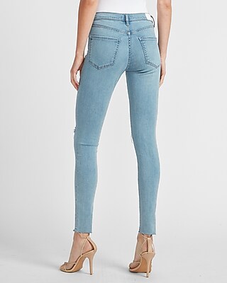 ripped raw hem skinny jeans