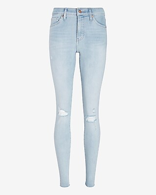 Mid Rise Light Wash Ripped Raw Hem Skinny Jeans