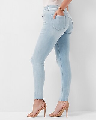 Mid Rise Light Wash Ripped Raw Hem Skinny Jeans