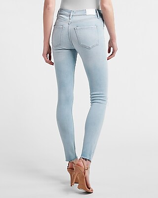 Mid Rise Light Wash Ripped Raw Hem Skinny Jeans