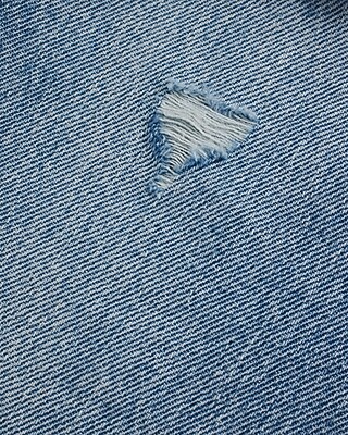 Mid Rise Medium Wash Distressed Boyfriend Jeans