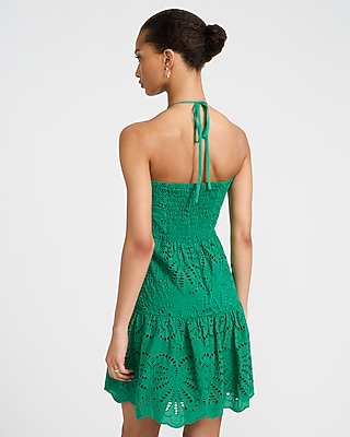 Eyelet Tie Halter Drop Waist Smocked Back Mini Dress