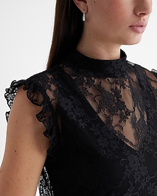 A woman in a black dress with a blazer and pumps