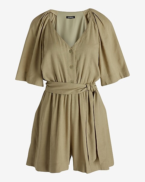 TOAST - DELAVE LINEN JUMPSUIT  Weighty delave linen, with a neat, gently  pointed collar. Bracelet-length sleeves, drawstring waist with self-fabric  ties to fasten. Dropped crotch, very wide, ankle-skimming trousers and  pockets